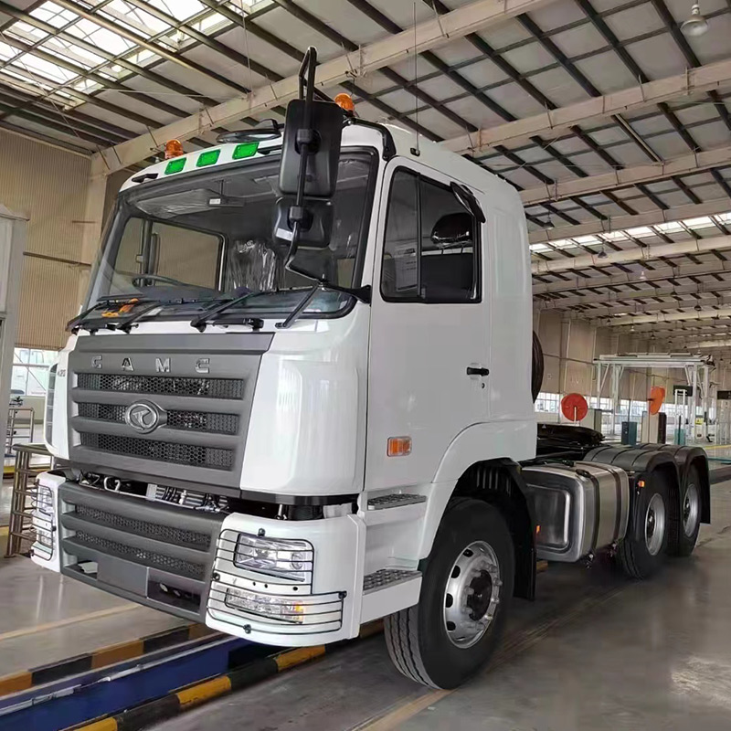 6X4 tractor truck performing heavy haulage tasks on challenging off-highway terrain