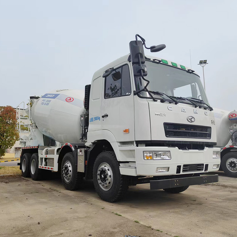 Electric concrete mixer truck operating on a modern construction site